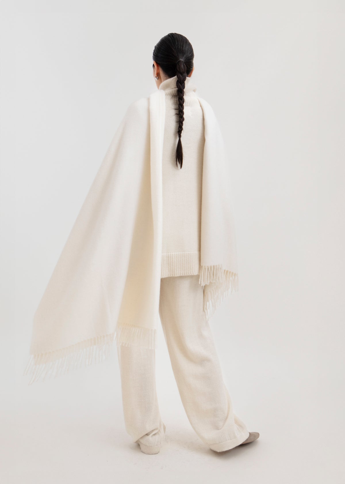Riley Scarf in Cream, blanket-size baby alpaca scarf by Ahblo, worn by model