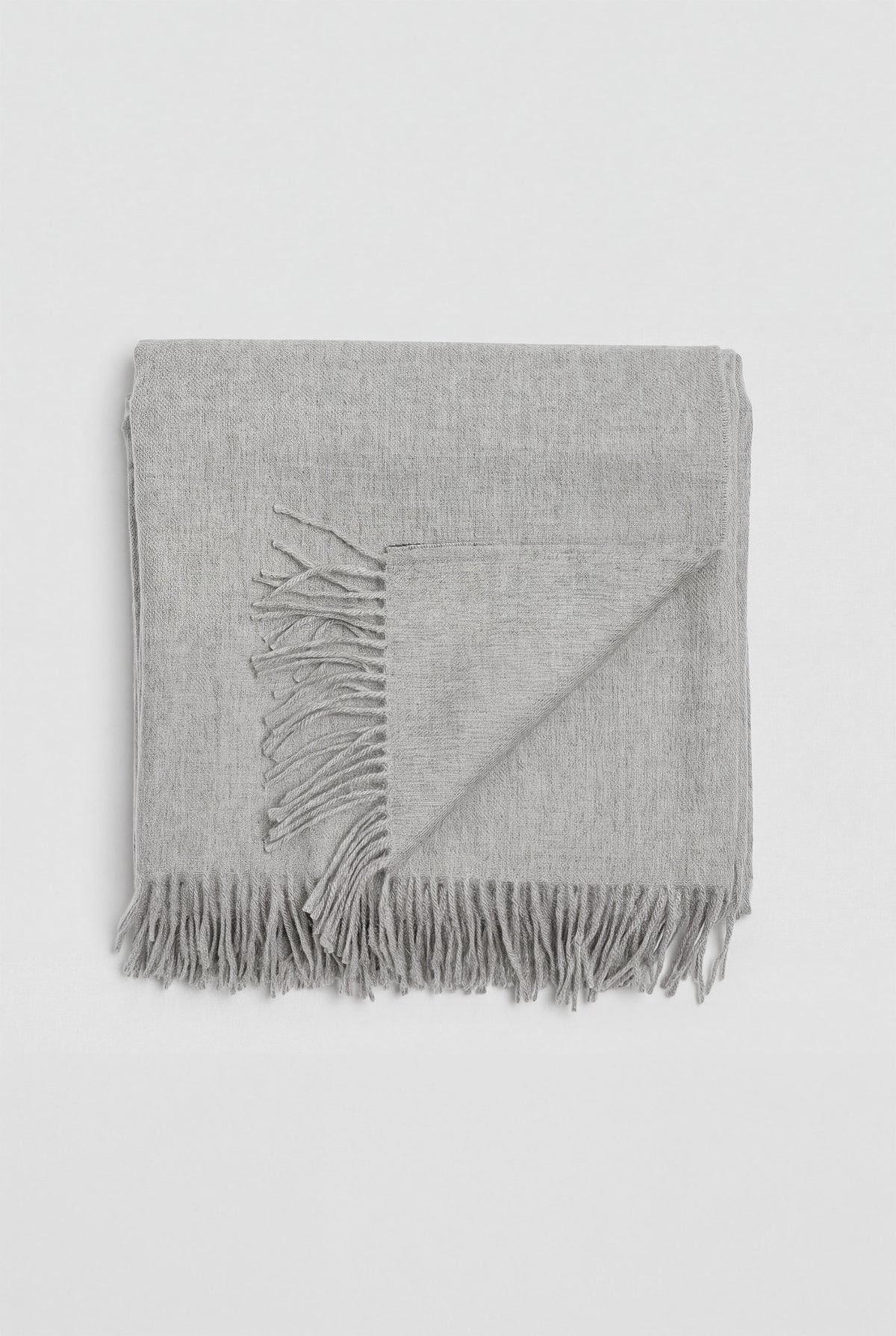 Riley Scarf in Mist Grey, blanket-size baby alpaca scarf by Ahblo, worn by model