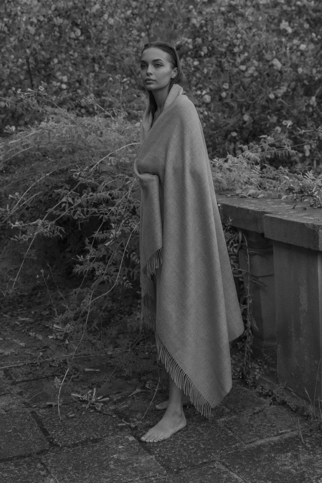 Riley Scarf in Mist Grey, blanket-size baby alpaca scarf by Ahblo, worn by model