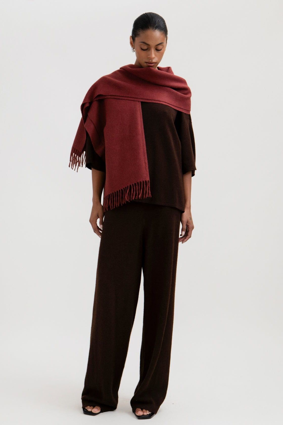 Rowan Scarf in Burgundy, fringed baby alpaca scarf by Ahblo, worn by model