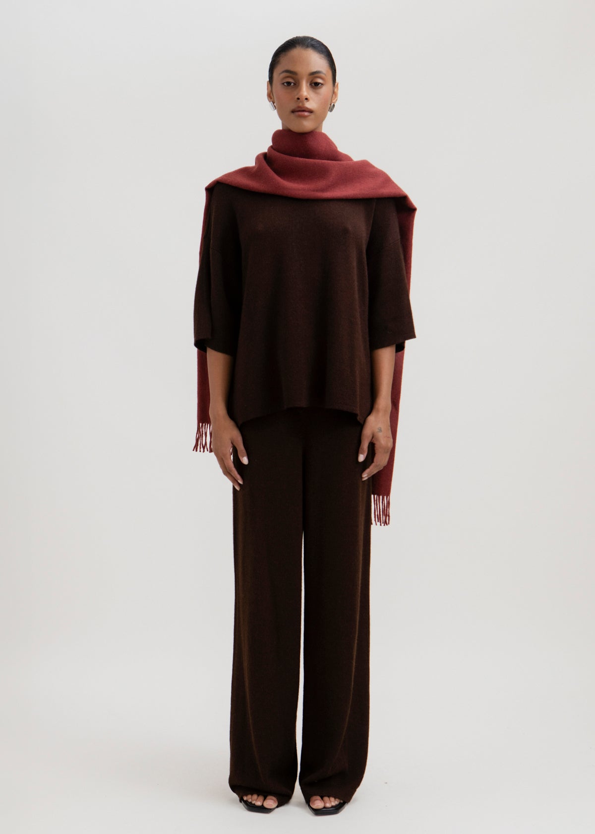 Rowan Scarf in Burgundy, fringed baby alpaca scarf by Ahblo, worn by model