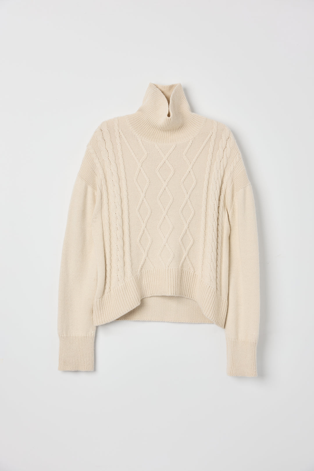 Sierra Cable Knit in Cream, oversized baby alpaca cable-knit sweater by Ahblo, flat lay