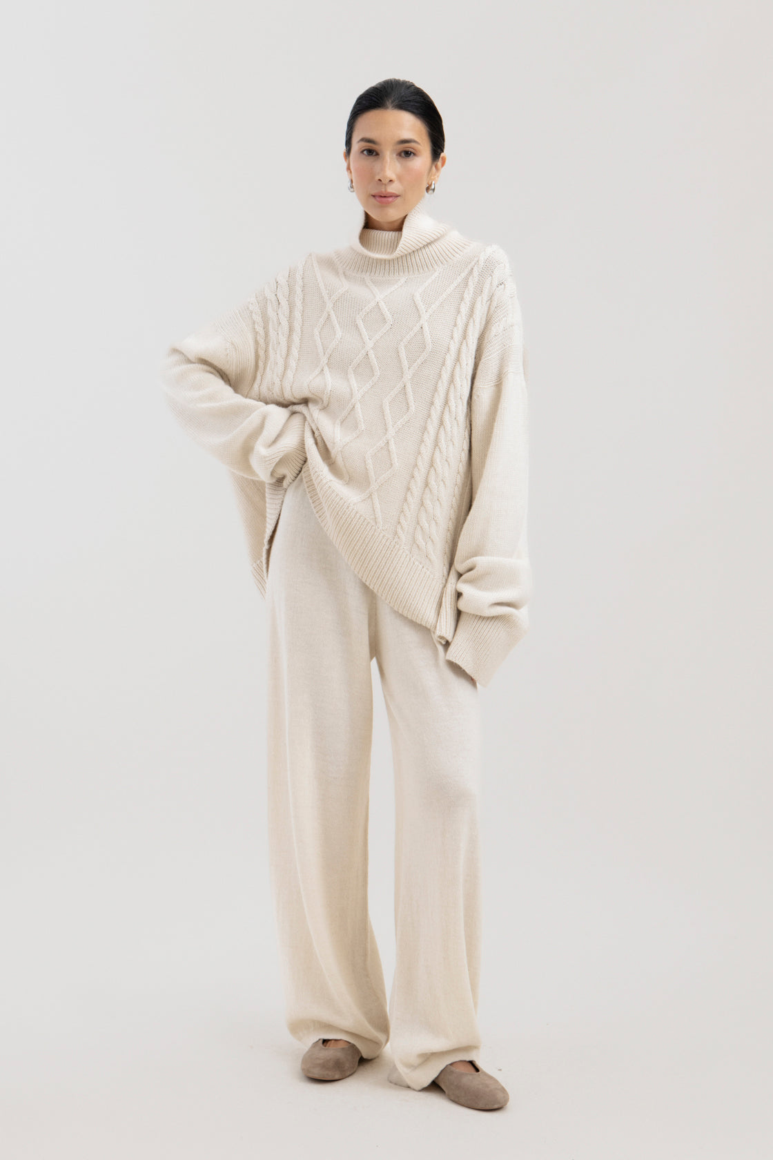 Sierra Cable Knit in Cream, oversized baby alpaca cable-knit sweater by Ahblo, worn by model