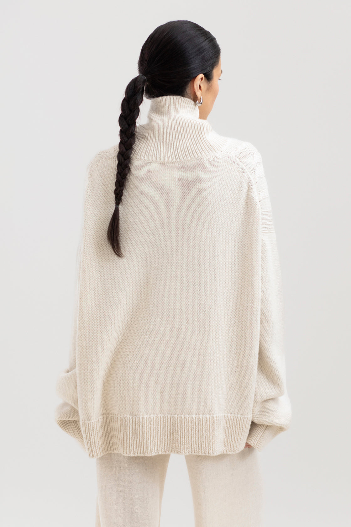 Sierra Cable Knit in Cream, oversized baby alpaca cable-knit sweater by Ahblo, worn by model