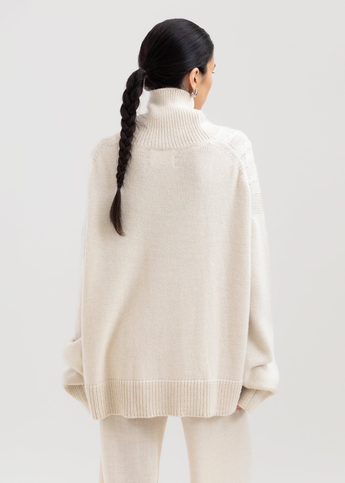 Sierra Cable Knit in Cream, oversized baby alpaca cable-knit sweater by Ahblo, worn by model