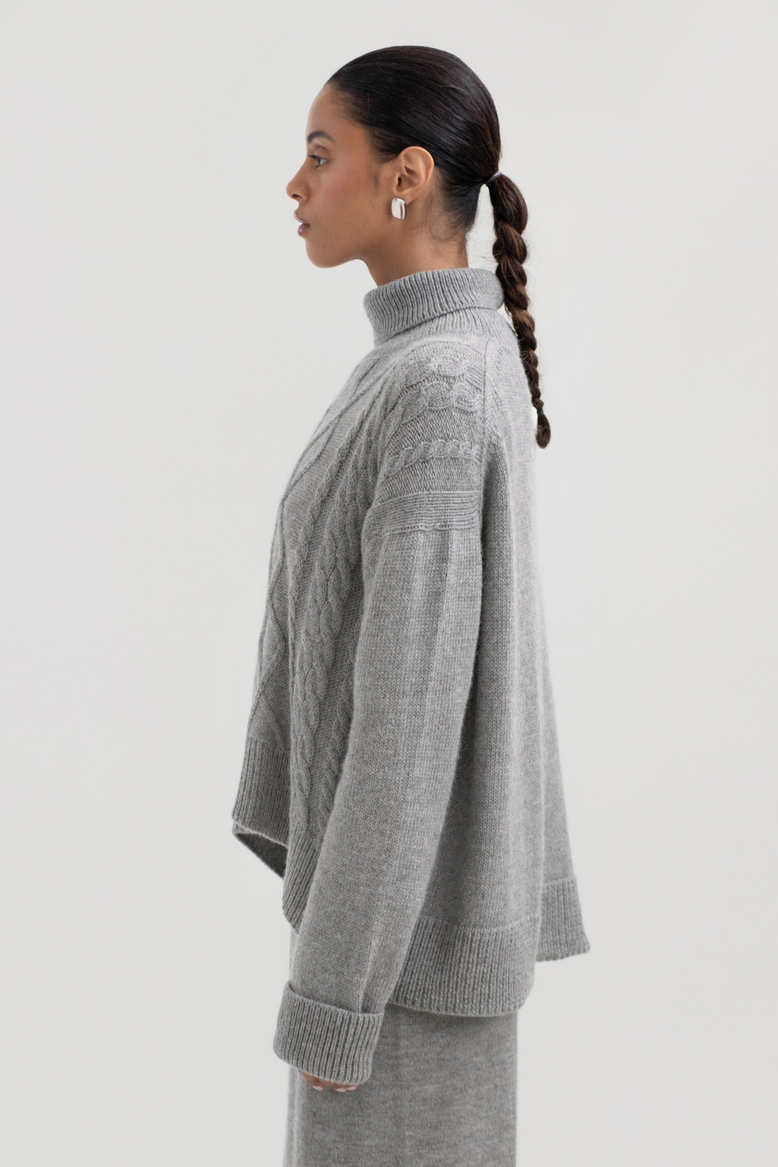 Sierra Cable Knit in Mist Grey, oversized baby alpaca cable-knit sweater by Ahblo, worn by model