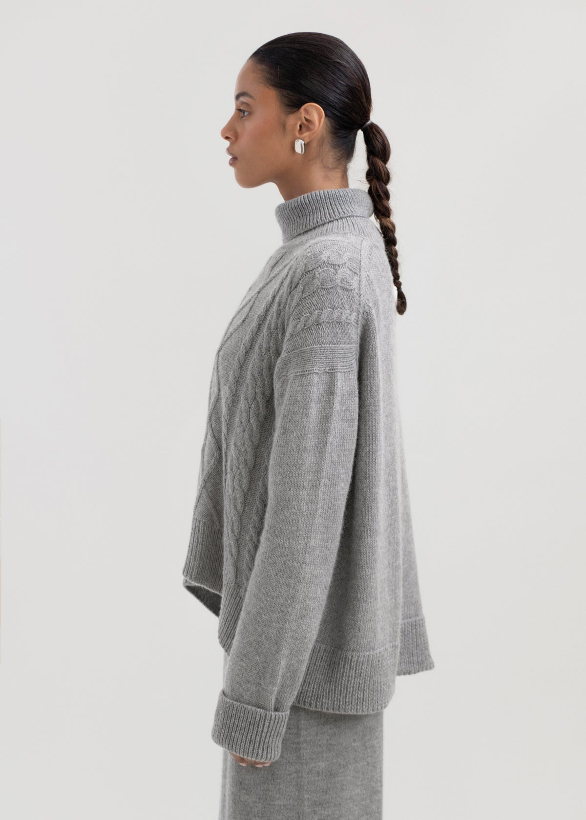 Sierra Cable Knit in Mist Grey, oversized baby alpaca cable-knit sweater by Ahblo, worn by model