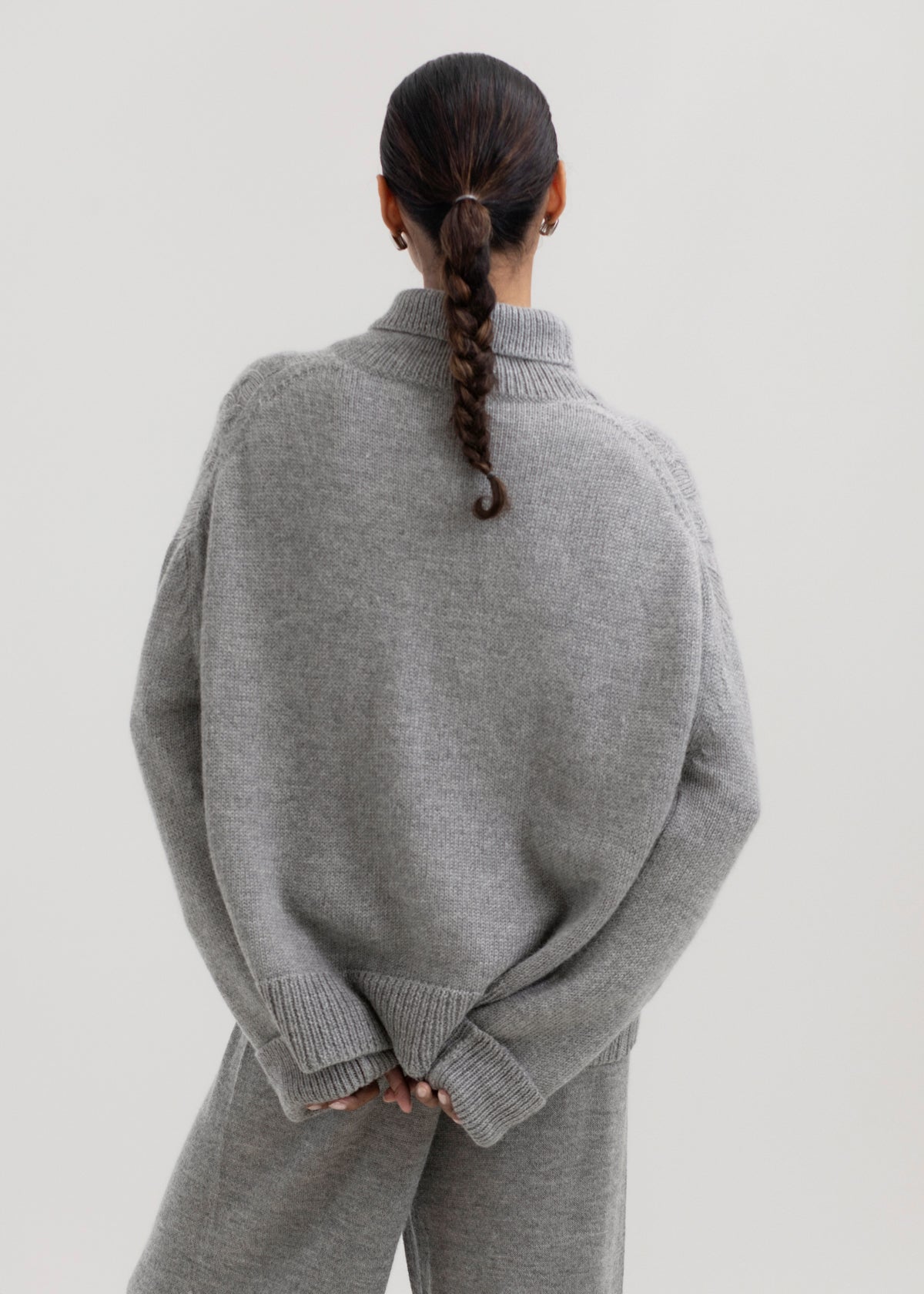 Sierra Cable Knit in Mist Grey, oversized baby alpaca cable-knit sweater by Ahblo, worn by model
