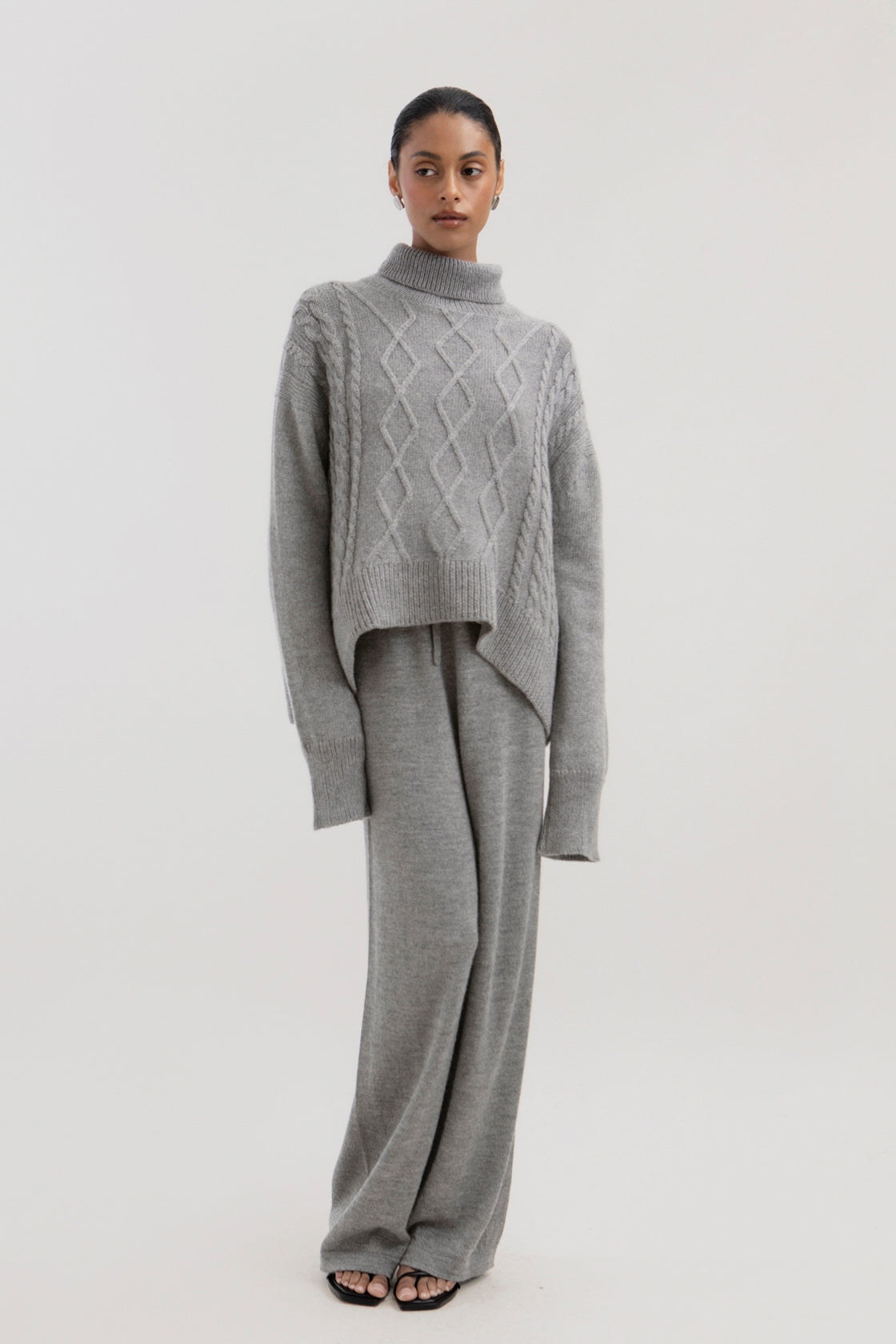 Sierra Cable Knit in Mist Grey, oversized baby alpaca cable-knit sweater by Ahblo, worn by model