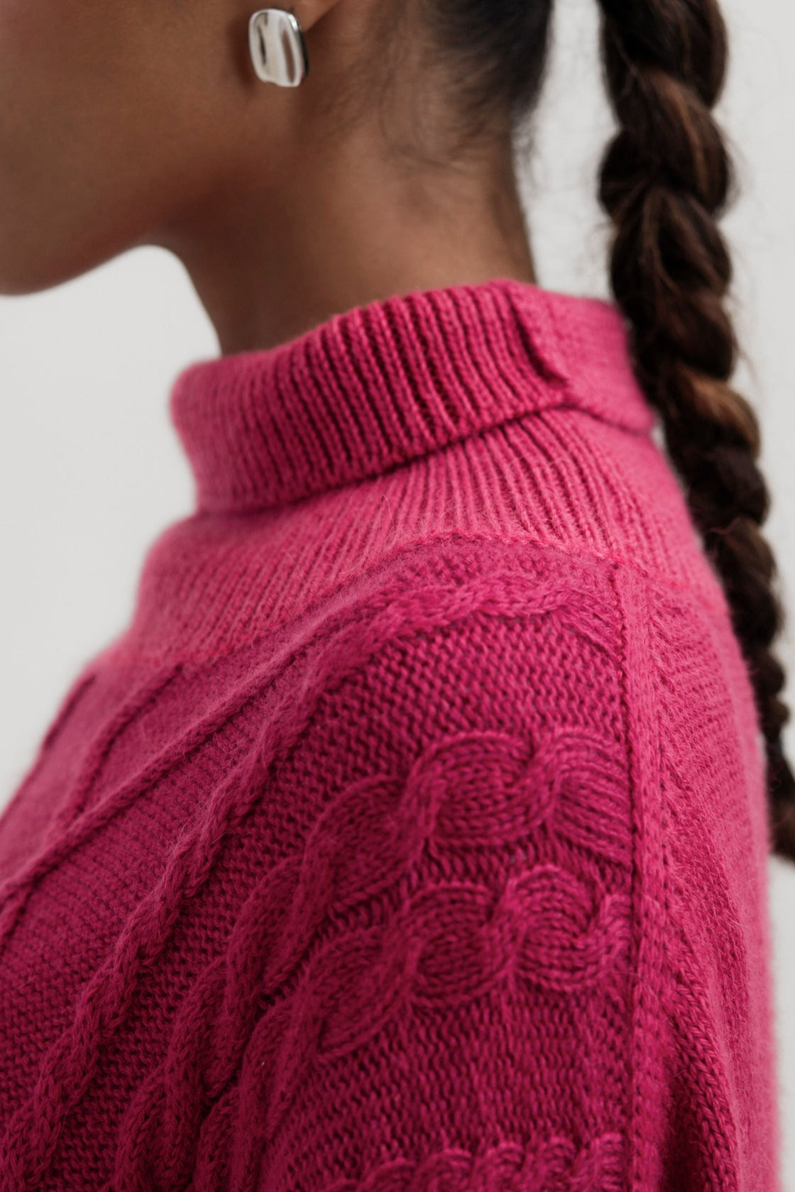 Sierra Cable Knit in Wild Pink, oversized baby alpaca cable-knit sweater by Ahblo, worn by model