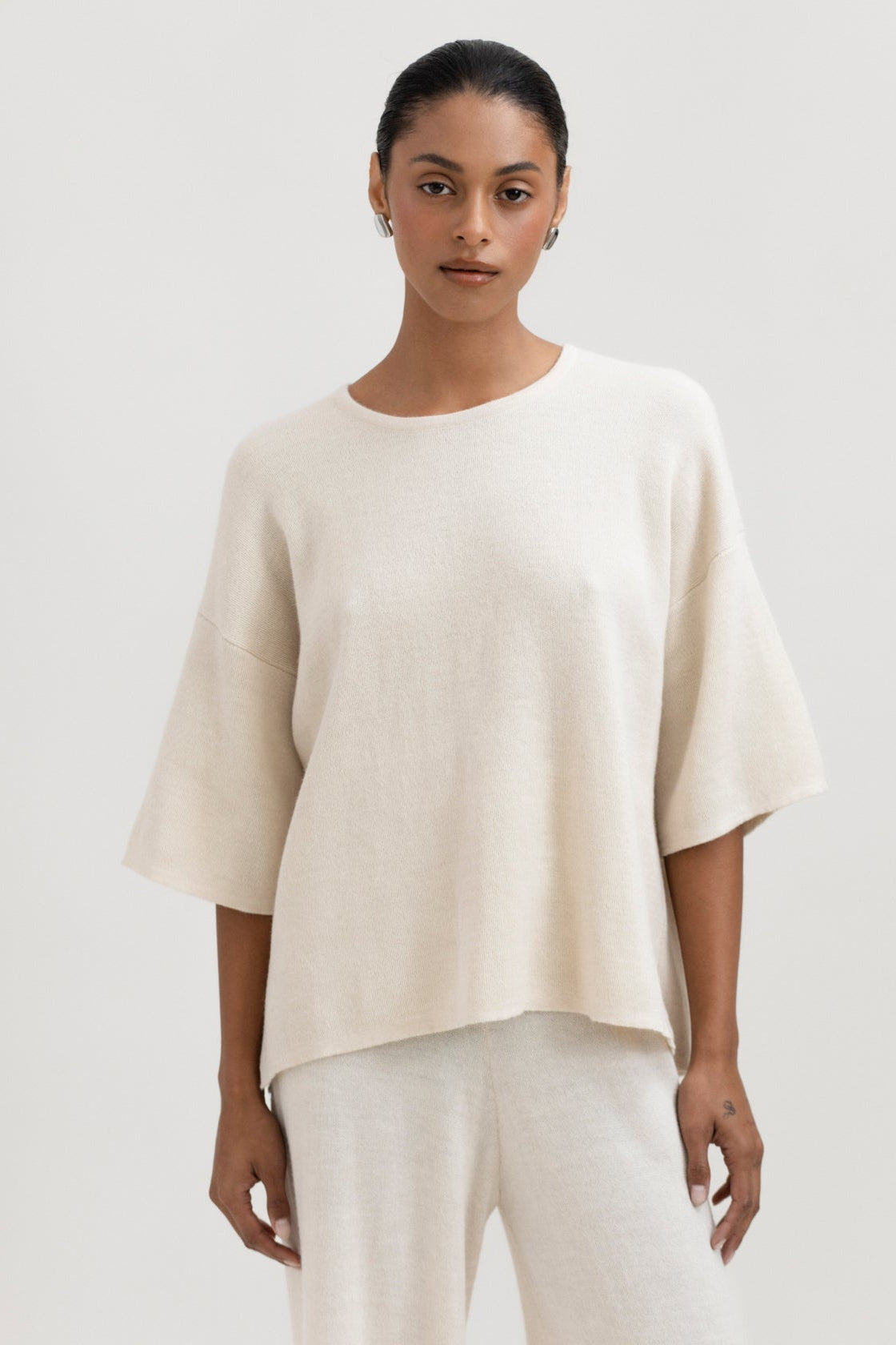 Solace Tee Sweater in Cream, alpaca tee sweater by Ahblo, worn by model
