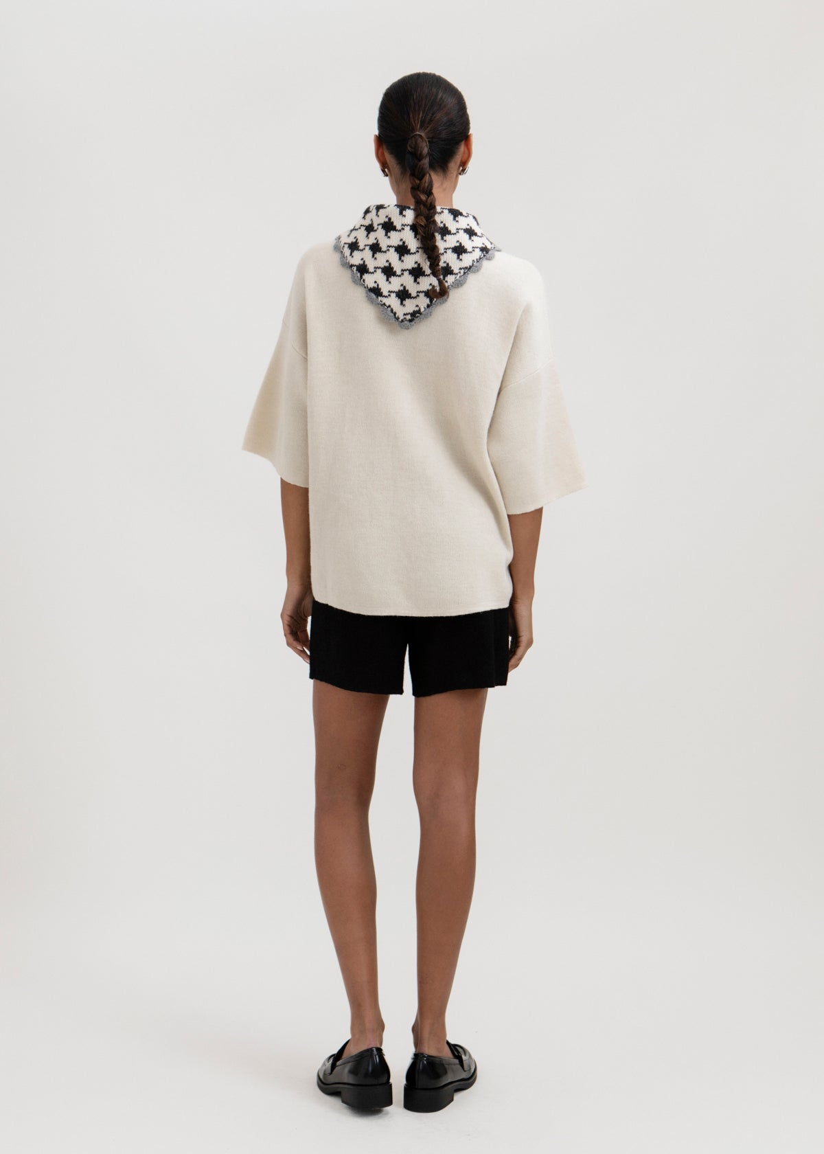 Tessa Scarf in Grey, reversible houndstooth baby alpaca triangle scarf by Ahblo, worn by model