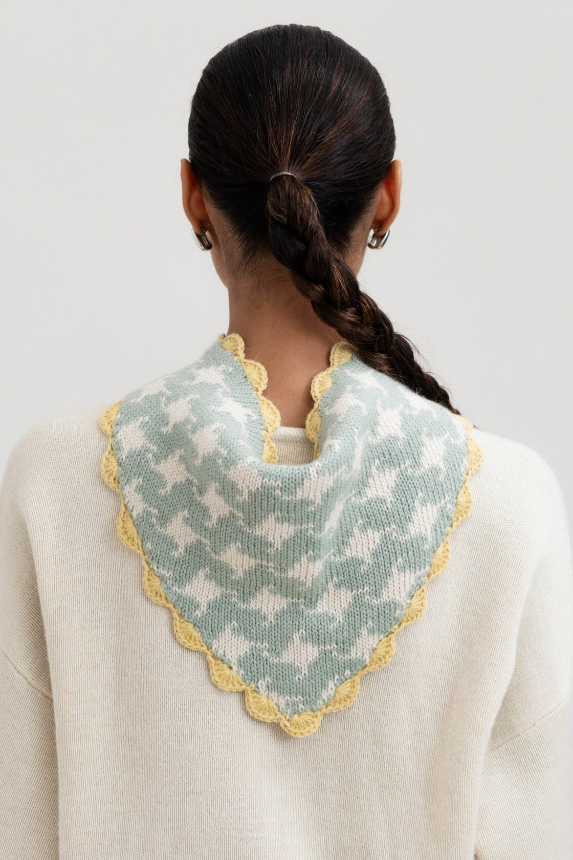 Tessa Scarf in Sage, reversible houndstooth baby alpaca triangle scarf by Ahblo, worn by model