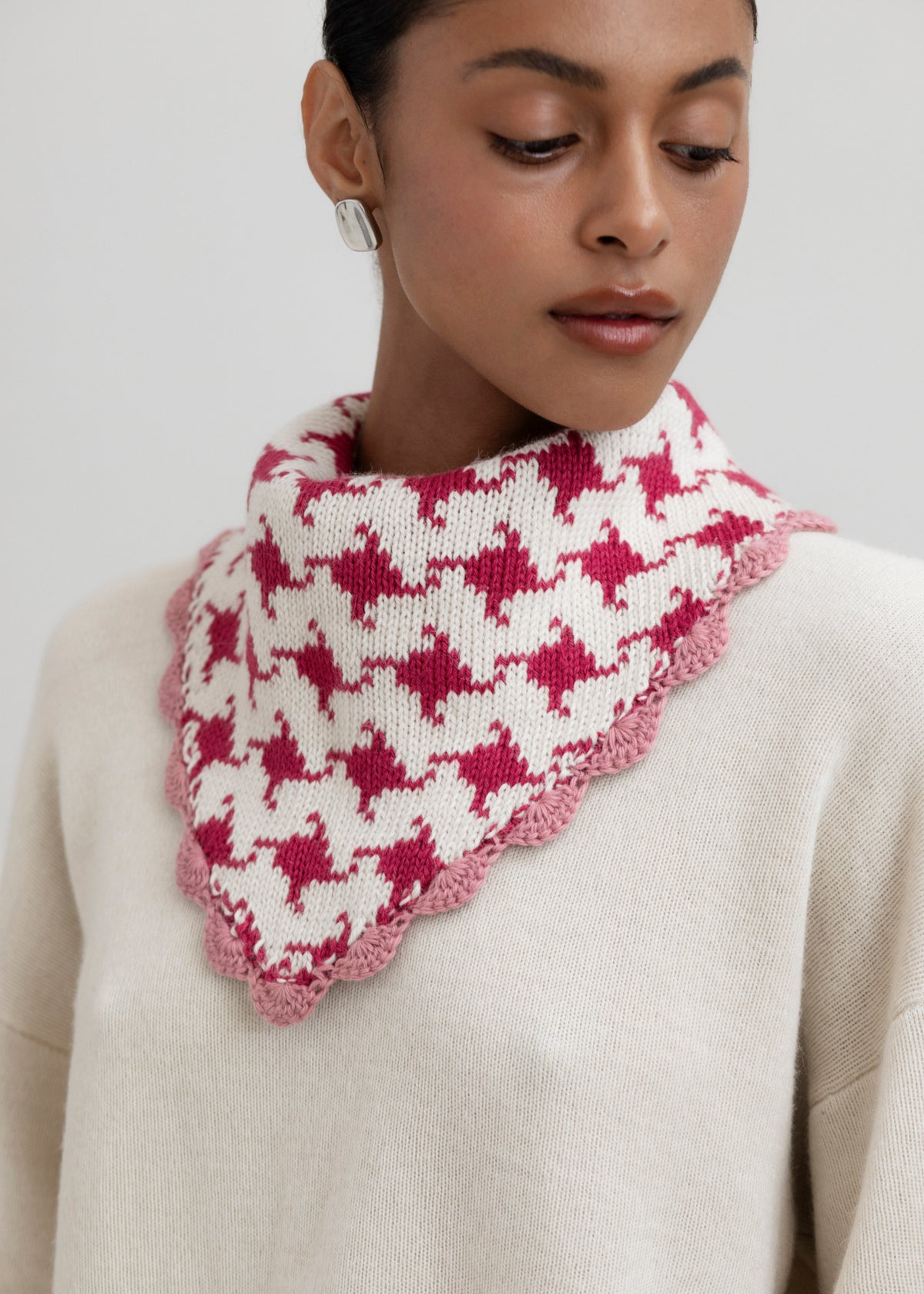 Tessa Scarf in Wild Rose, reversible houndstooth baby alpaca triangle scarf by Ahblo, worn by model