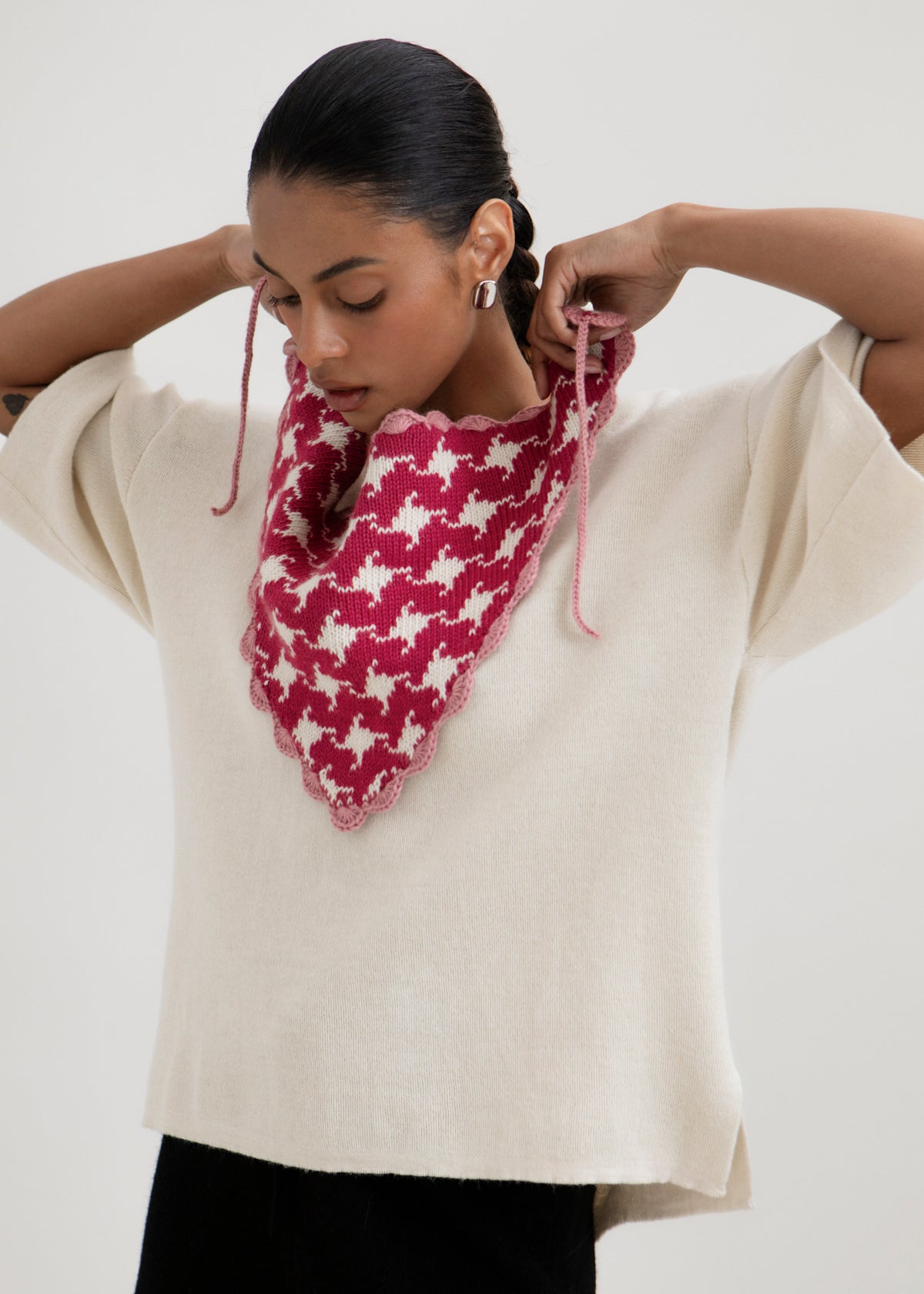 Tessa Scarf in Wild Rose, reversible houndstooth baby alpaca triangle scarf by Ahblo, worn by model