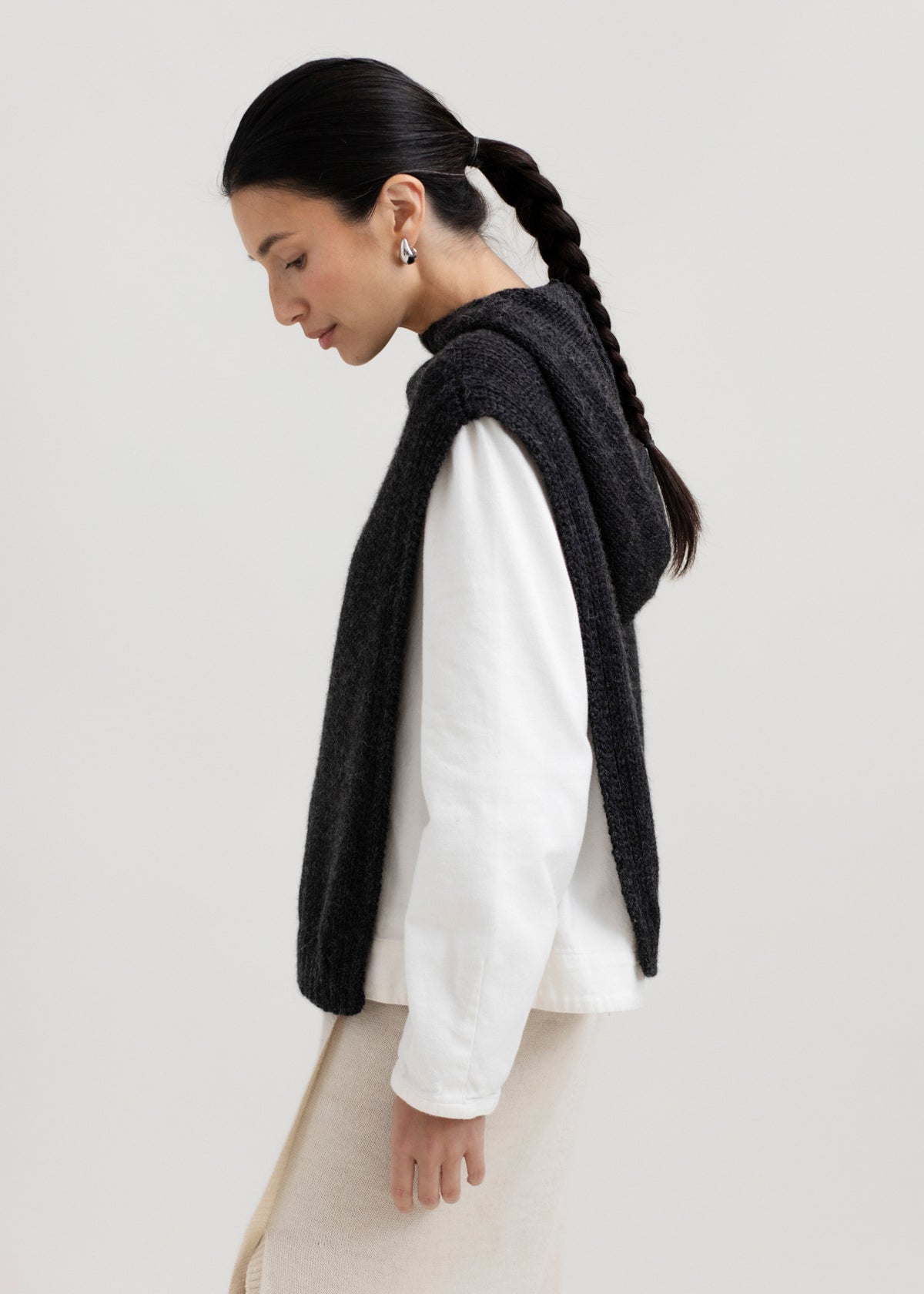 Tofino Poncho in Charcoal, baby alpaca mini poncho by Ahblo, worn by model