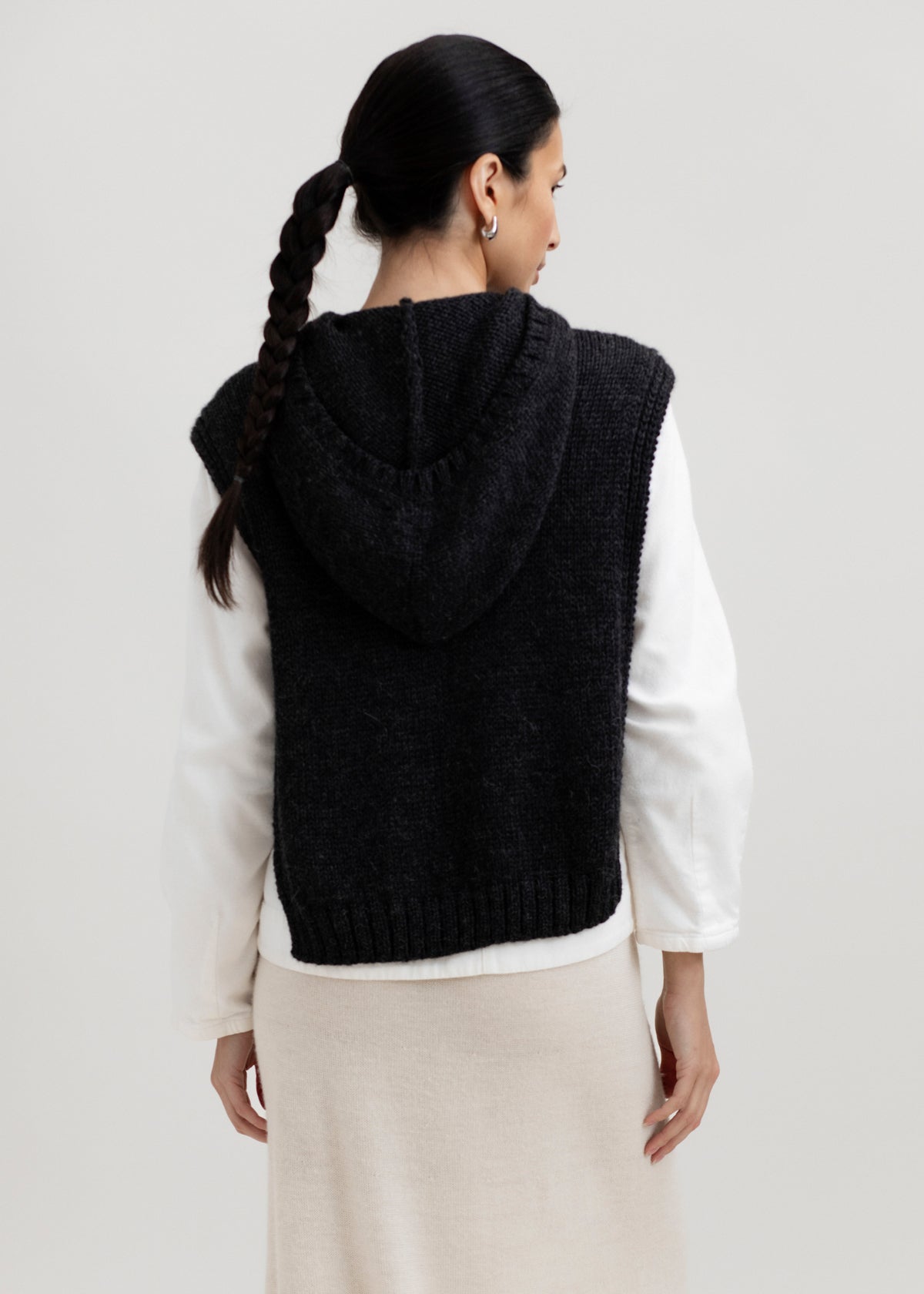 Tofino Poncho in Charcoal, baby alpaca mini poncho by Ahblo, worn by model