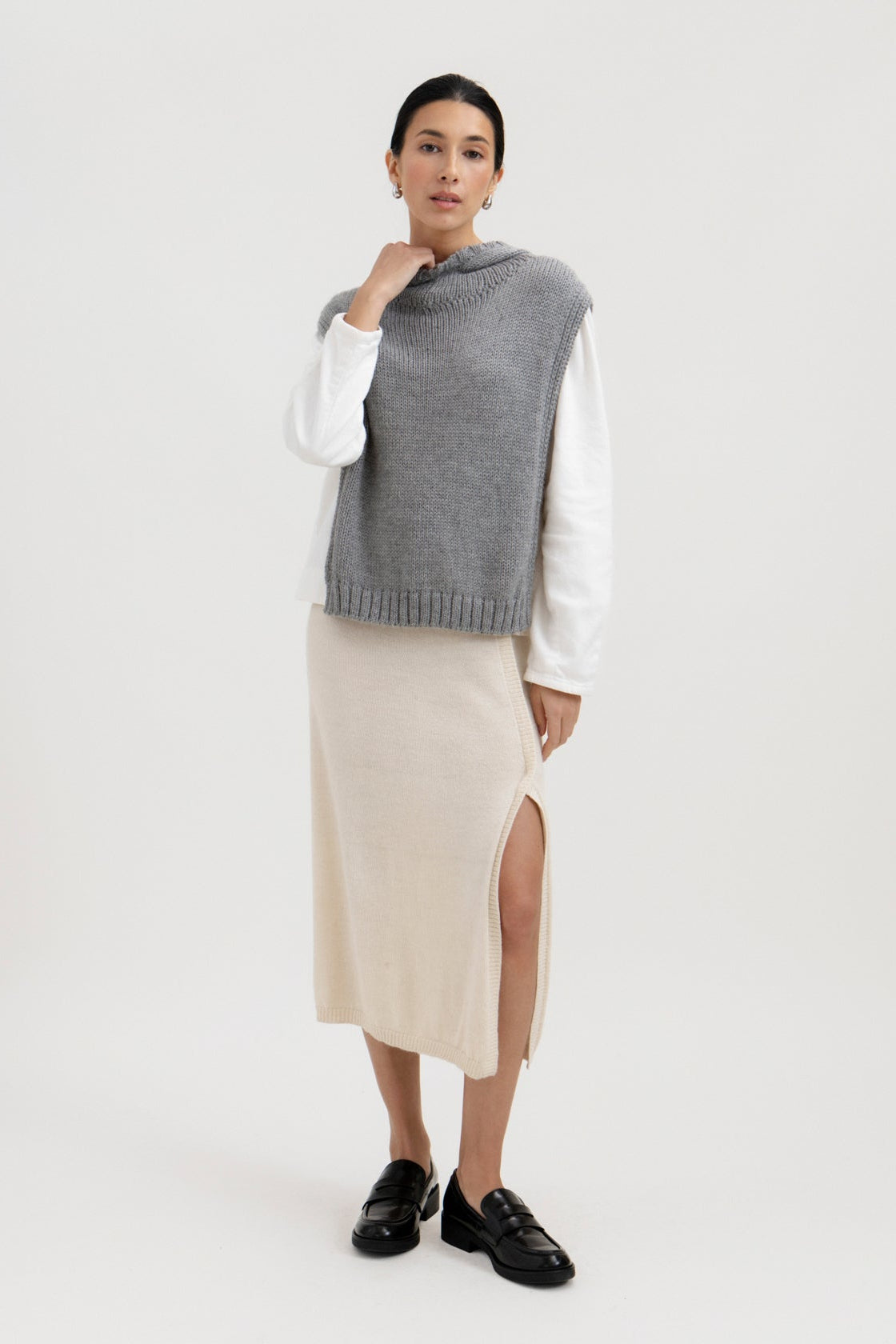 Tofino Poncho in Mist Grey, baby alpaca mini poncho by Ahblo, worn by model