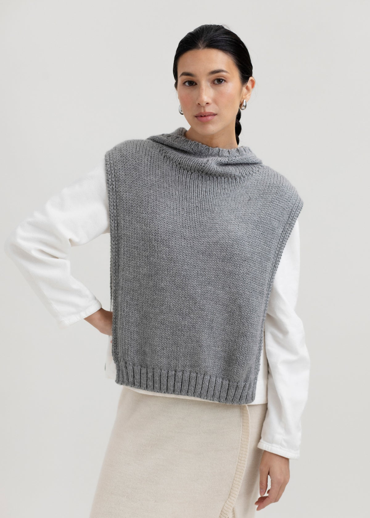 Tofino Poncho in Mist Grey, baby alpaca mini poncho by Ahblo, worn by model