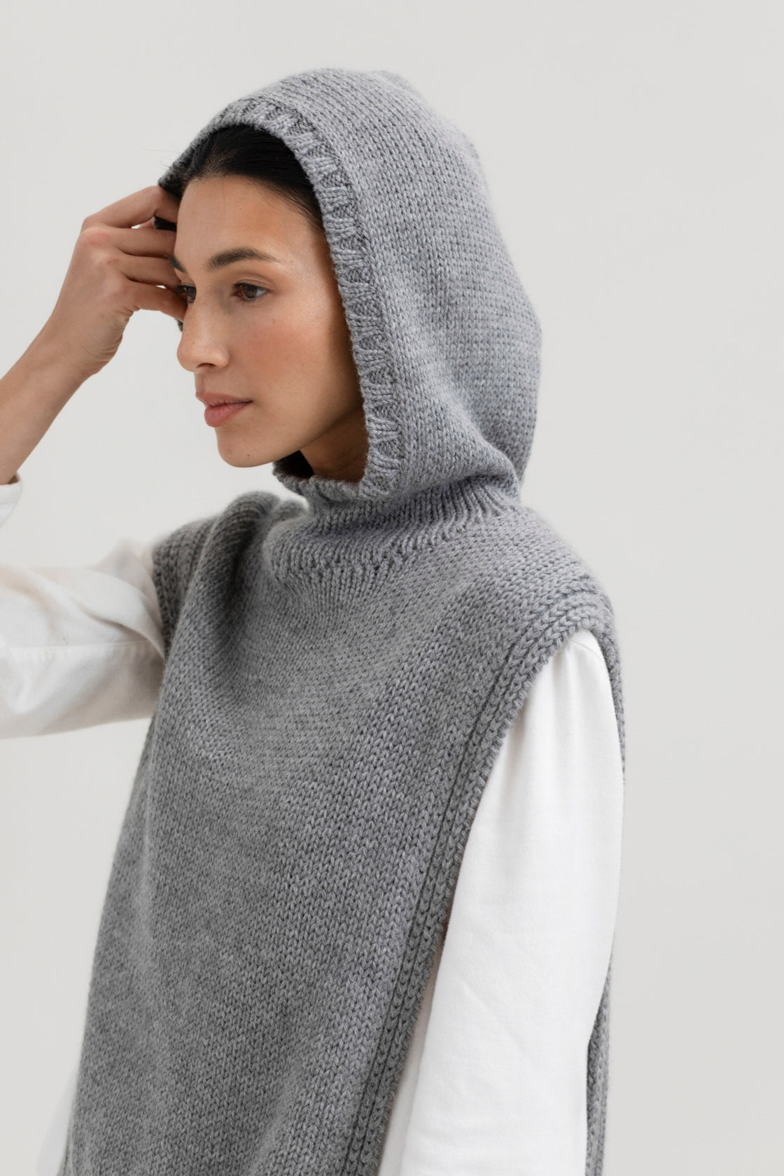 Tofino Poncho in Mist Grey, baby alpaca mini poncho by Ahblo, worn by model