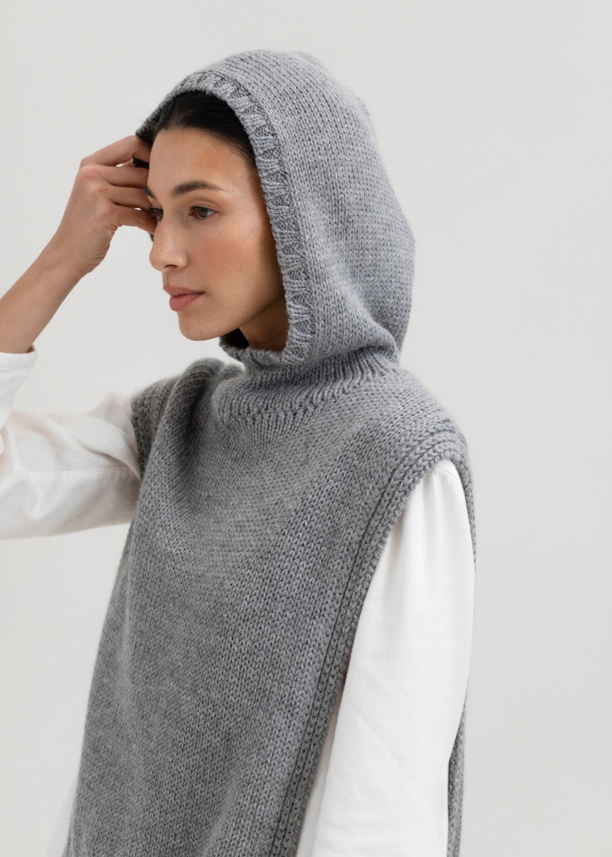 Tofino Poncho in Mist Grey, baby alpaca mini poncho by Ahblo, worn by model