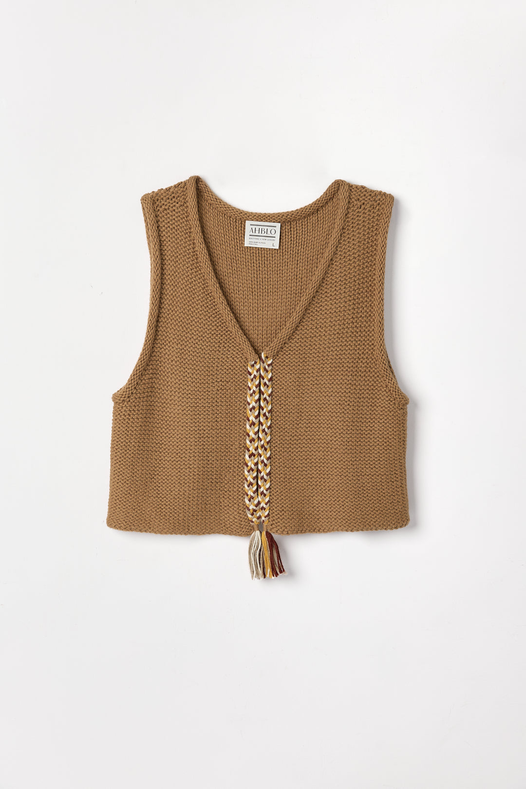 Vela Braid Vest in Caramel, baby alpaca knit vest with hand-braided trim by Ahblo, flat lay