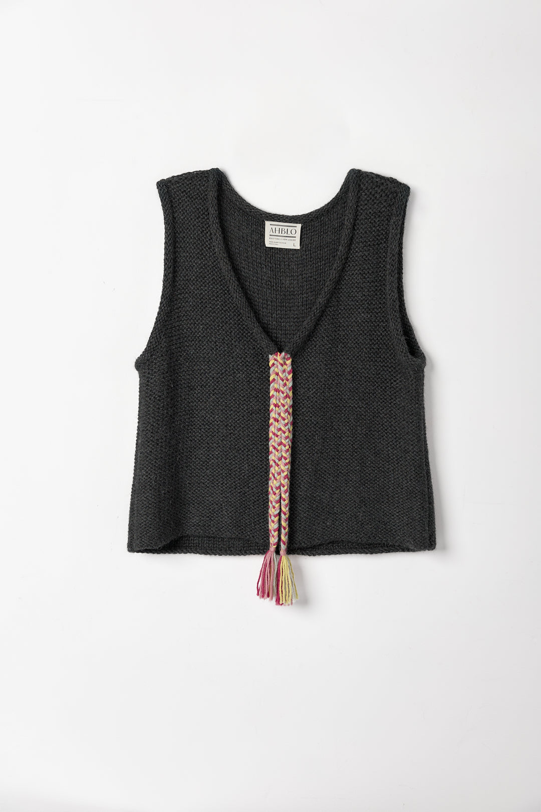 Vela Braid Vest in Charcoal, baby alpaca knit vest with hand-braided trim by Ahblo, flat lay