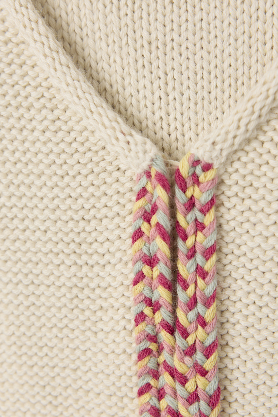 Vela Braid Vest in Cream, baby alpaca knit vest with hand-braided trim by Ahblo, flat lay