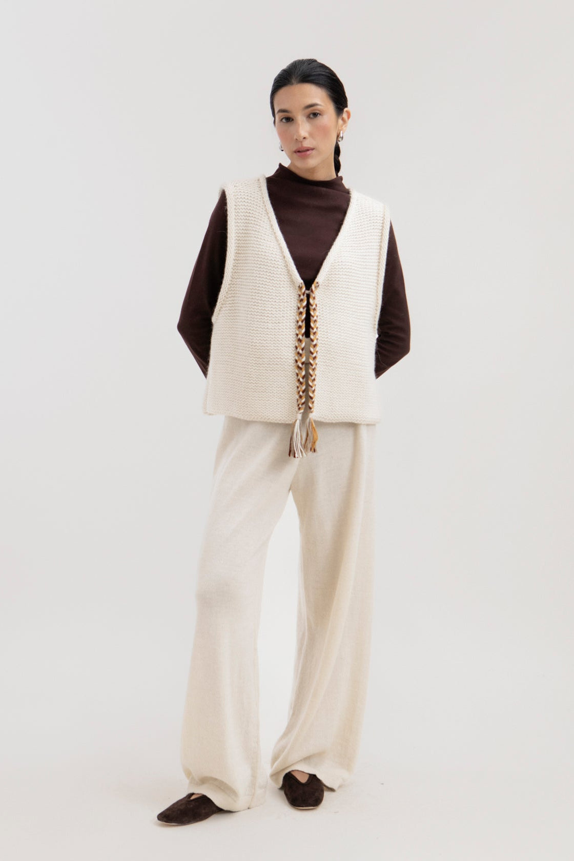 Vela Braid Vest in Ivory, baby alpaca knit vest with hand-braided trim by Ahblo, worn by model