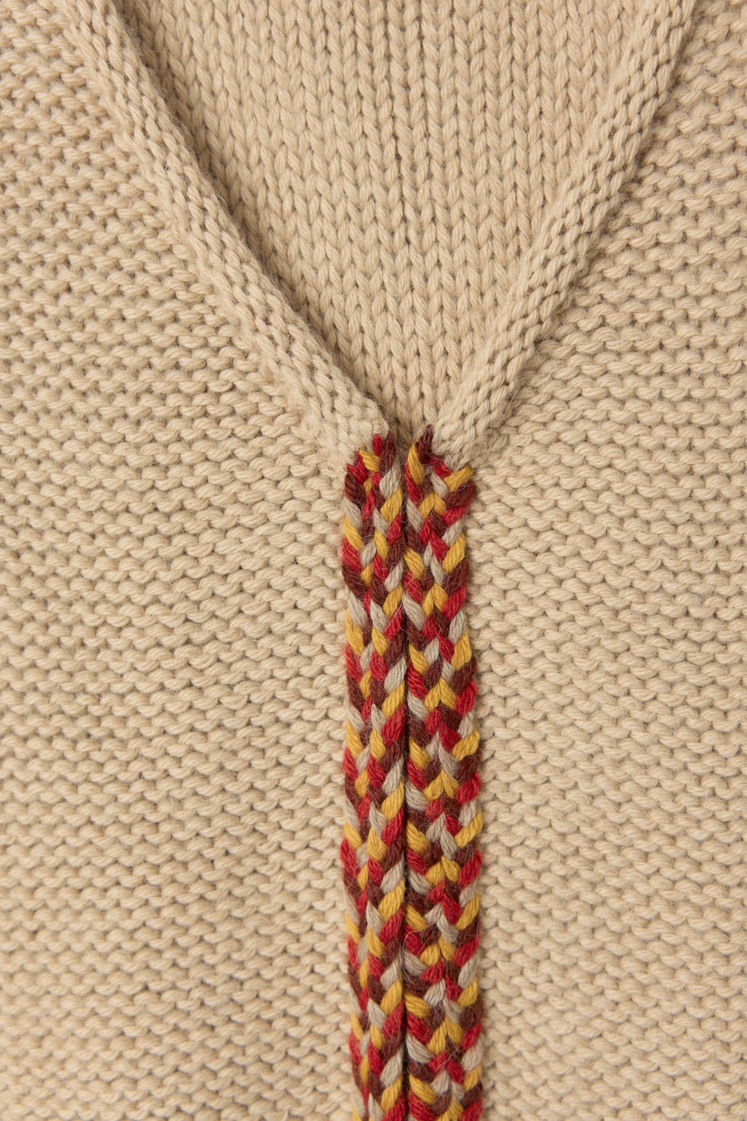 Vela Braid Vest in Praline, baby alpaca knit vest with hand-braided trim by Ahblo, flat lay