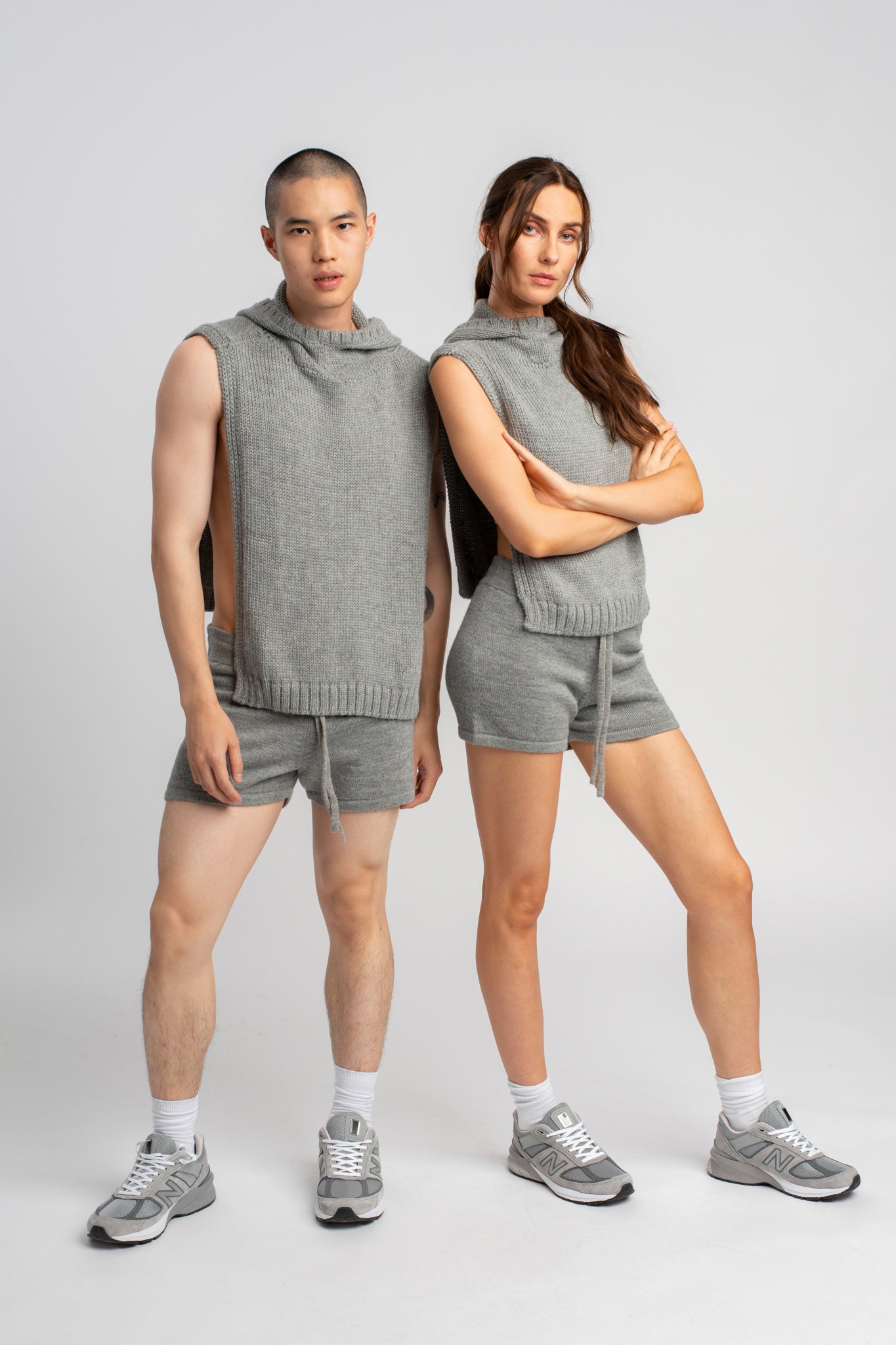 Two models wearing poncho in light grey alpaca wool